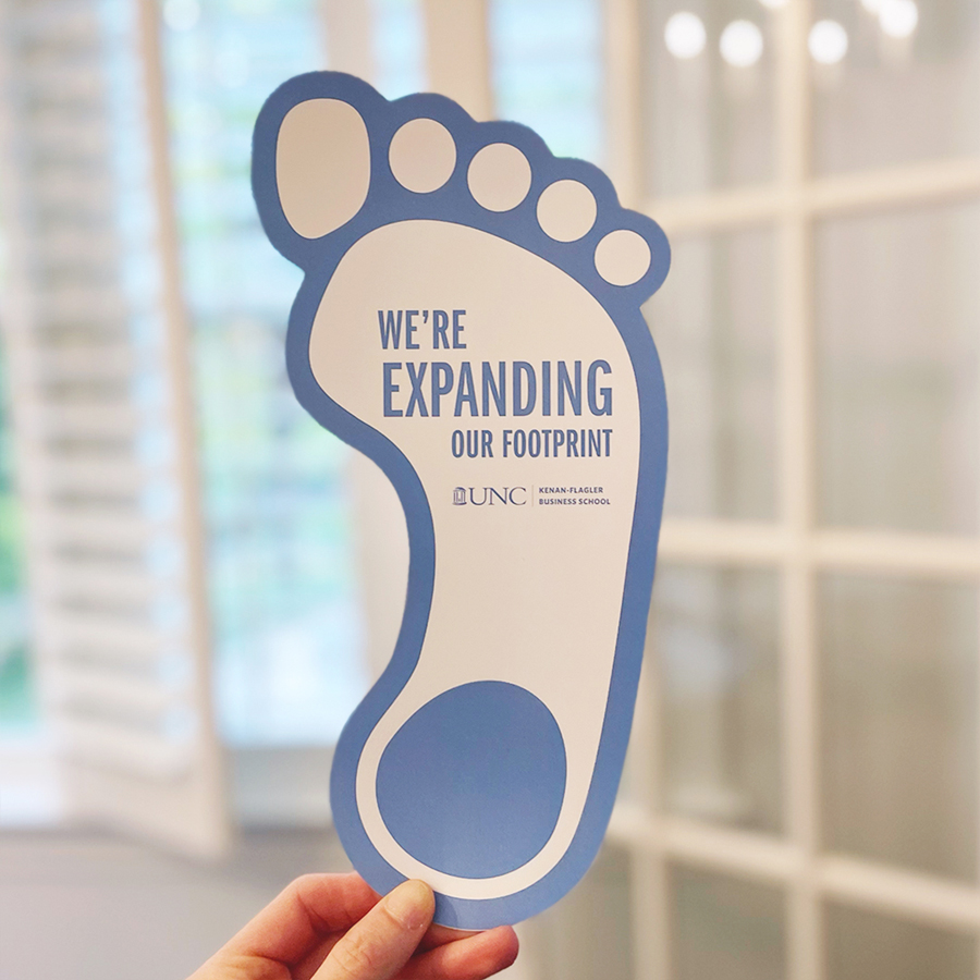 UNC Groundbreaking Save the Date foot shaped invitation. The title says, We're expanding our footprint!